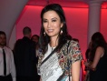 45歲鄧文迪穿短裙化濃妝扮嫩 離婚后混跡富人圈